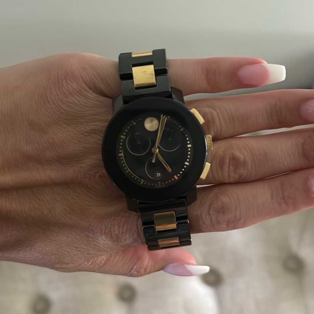 Movado black and golds woman’s watch